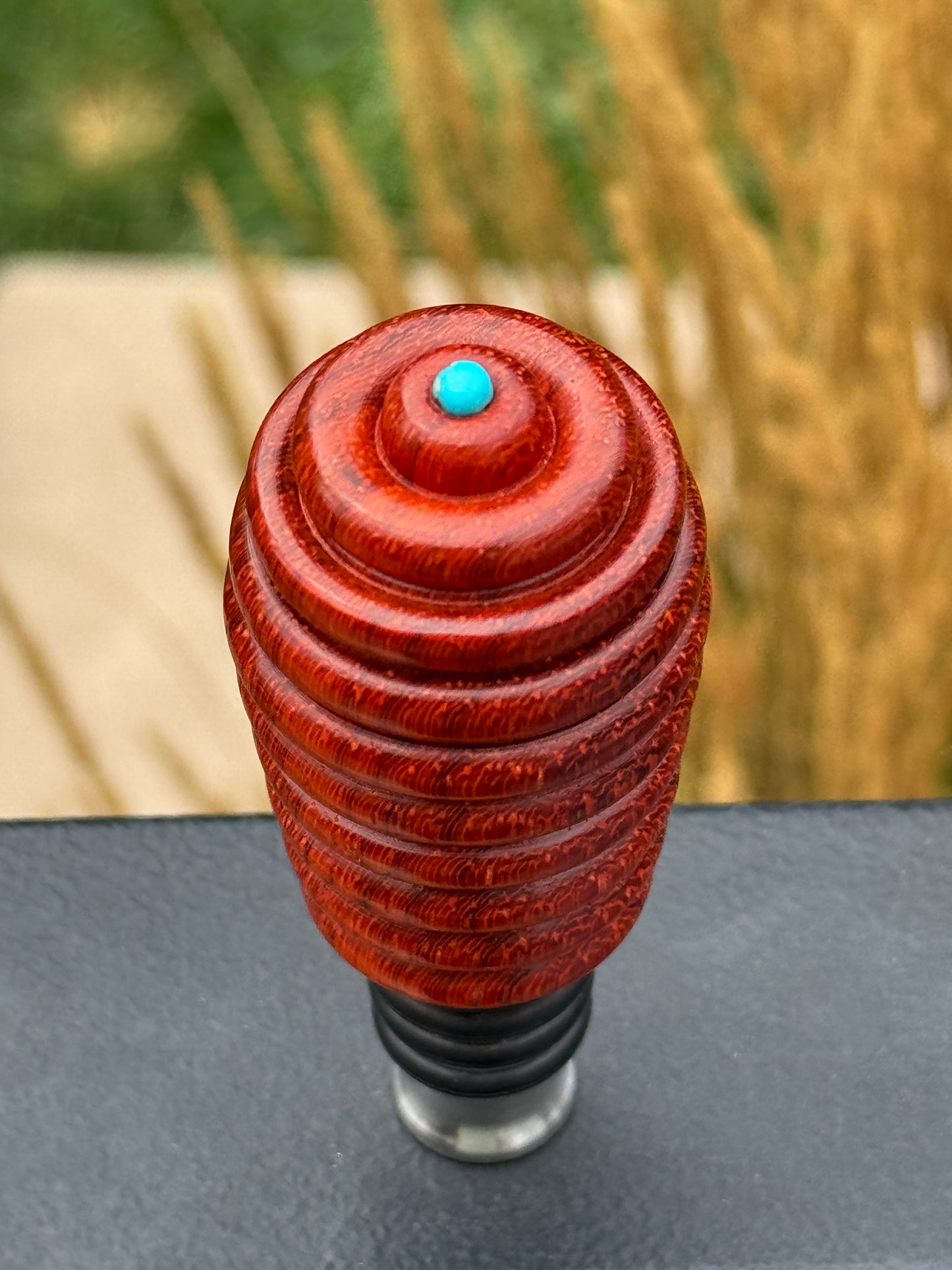 #128 - Padauk Bottle Stopper with Sleeping Beauty Turquoise Cabochon